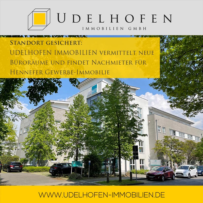 Bürogebäude von Udelhofen Immobilien GmbH bei Sonnenschein.