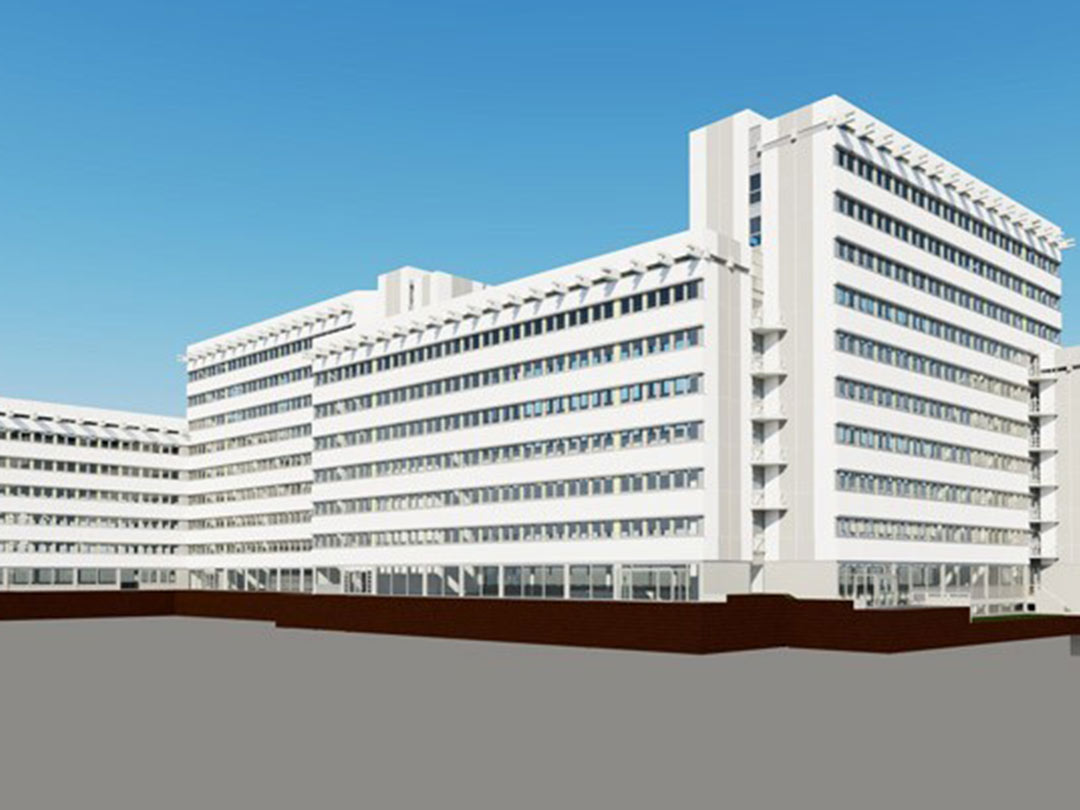 Modernes weißes Gebäude mit vielen Fenstern.